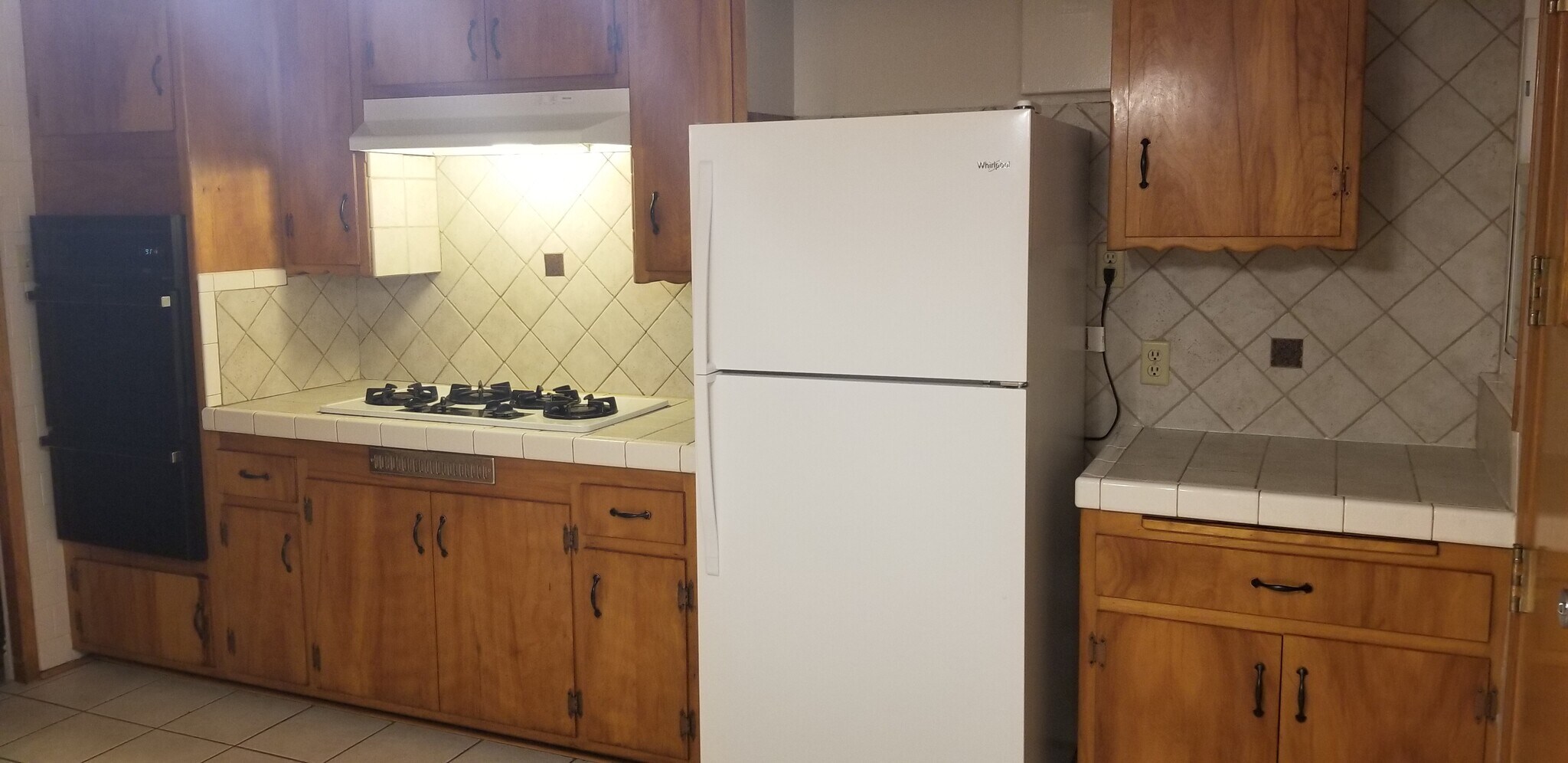Stove top and wall over - 512 S Flower St