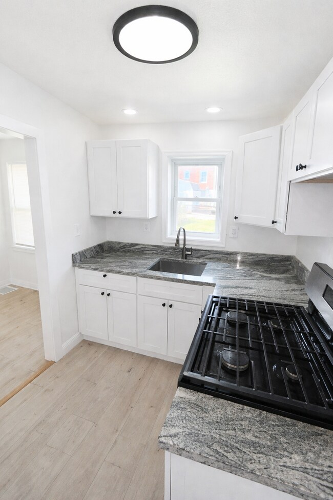 Building Photo - Renovated Home with Modern Kitchen, Basement & Natural Light