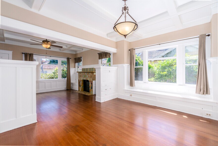 Built ins in dining area include desk and bench seating storage with picture window - 367 Junipero Ave