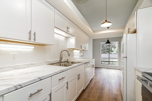 Building Photo - Top-Floor Condo with Forest Views, Large Private Deck & Resort-Style Amenities