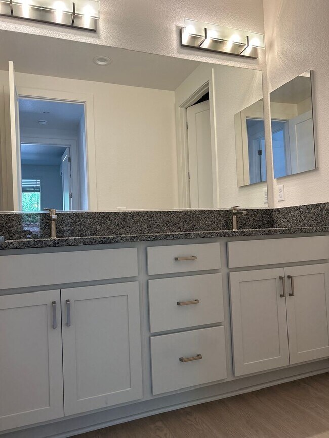 Building Photo - Coming soon! Lower unit  2 bed 1 bath townhome with attached garage