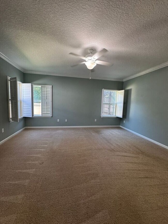 Building Photo - COMING SOON! Beautiful 4BR 3BA Home w/ Screened Lanai & Pond View • Garage Parking • Fenced Yard ...