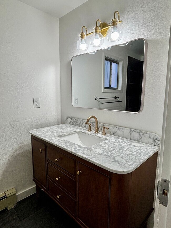 Building Photo - Updated 3BR Evergreen Home w/ Garage & Fenced Yard