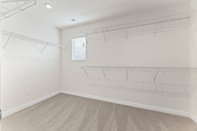 Building Photo - Classic finishes paired with an open, versatile layout!