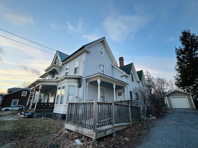 Wheelchair accessible ramp with side door access. - 23 Pleasant St