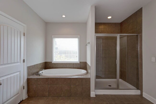 Building Photo - 4BR/3.5BA · 2,809 SF · Owner's Suite on Main · Fenced Yard · Midland, GA — $2,800/mo