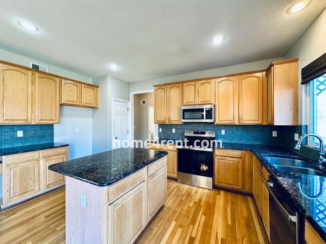 Building Photo - Gorgeous, Updated Home w/ Granite Counters and Wood Floors in Kitchen, Walkout Finished Basement!