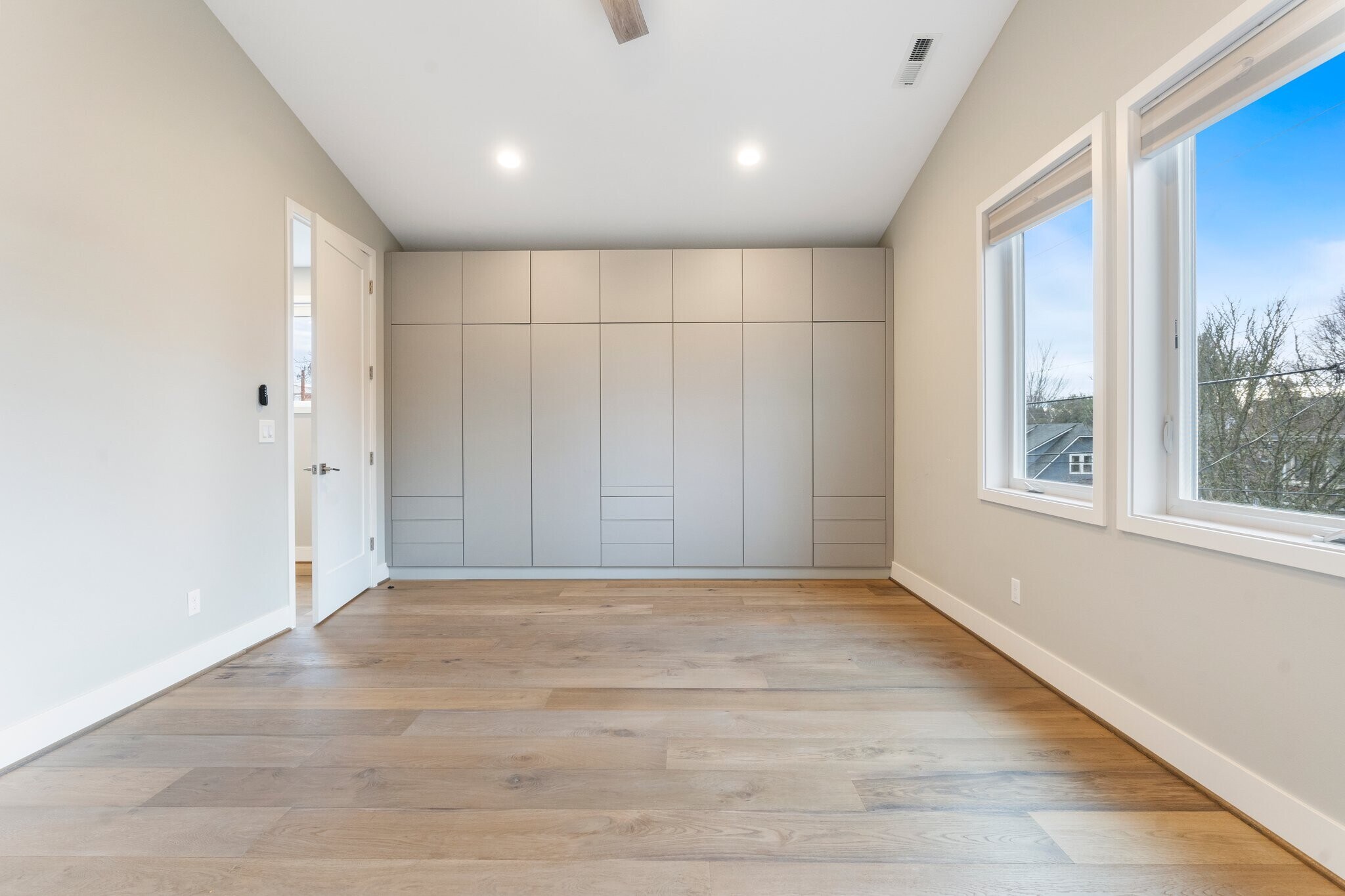 Primary bedroom with built in closets. - 2335 NE Couch St