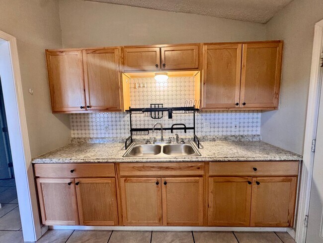 Building Photo - Charming 3-bedroom, 1-bath home featuring an attached carport and a fully fenced backyard—perfect...