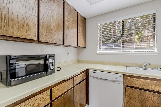 Building Photo - Stylish End-Unit Condo l Private Patio l Community Pool