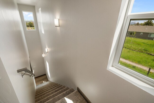 Building Photo - Pet Friendly! Gorgeous 3 Bedroom condo with double stall attached garages with AC.