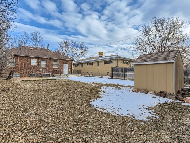 Building Photo - Evolve Real Estate: Available 8/8/26 Brick Tudor with Large Yard and Finished Basement!