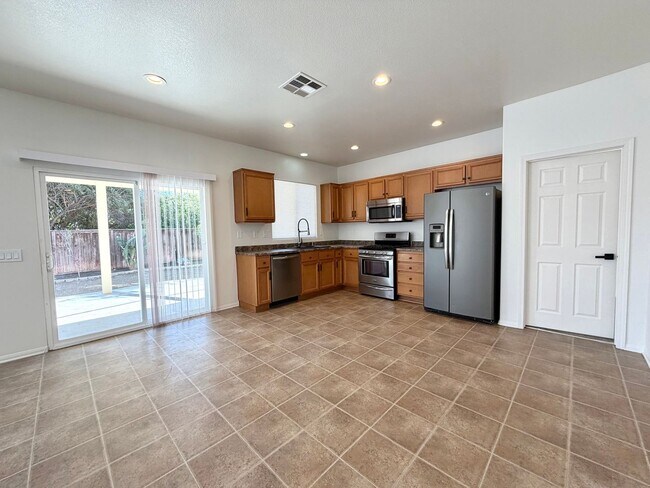 Building Photo - Energy Efficient 5 Bedroom Home with Paid Solar & Covered Patio