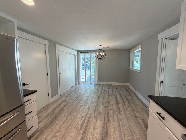 Building Photo - Spacious 4BR/3BA Home with Deck, Fenced Yard & Garage