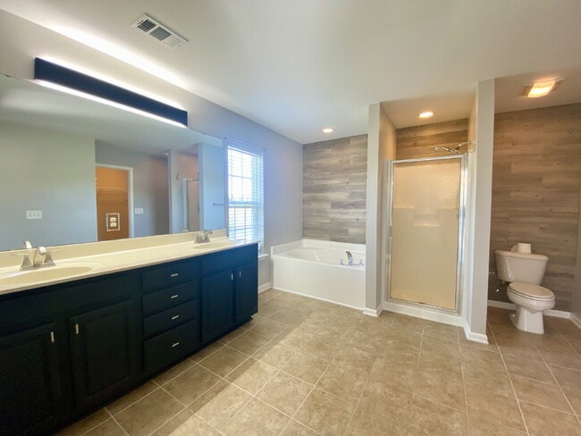 Building Photo - Three Bedroom Home with fenced-in Backyard oasis!