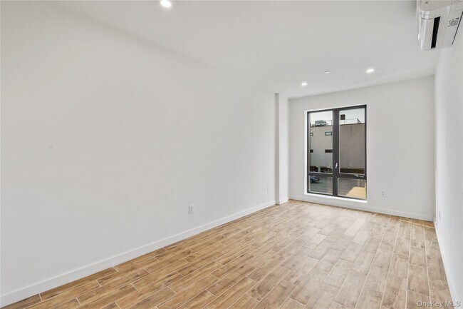 Building Photo - 213-41 38th Ave