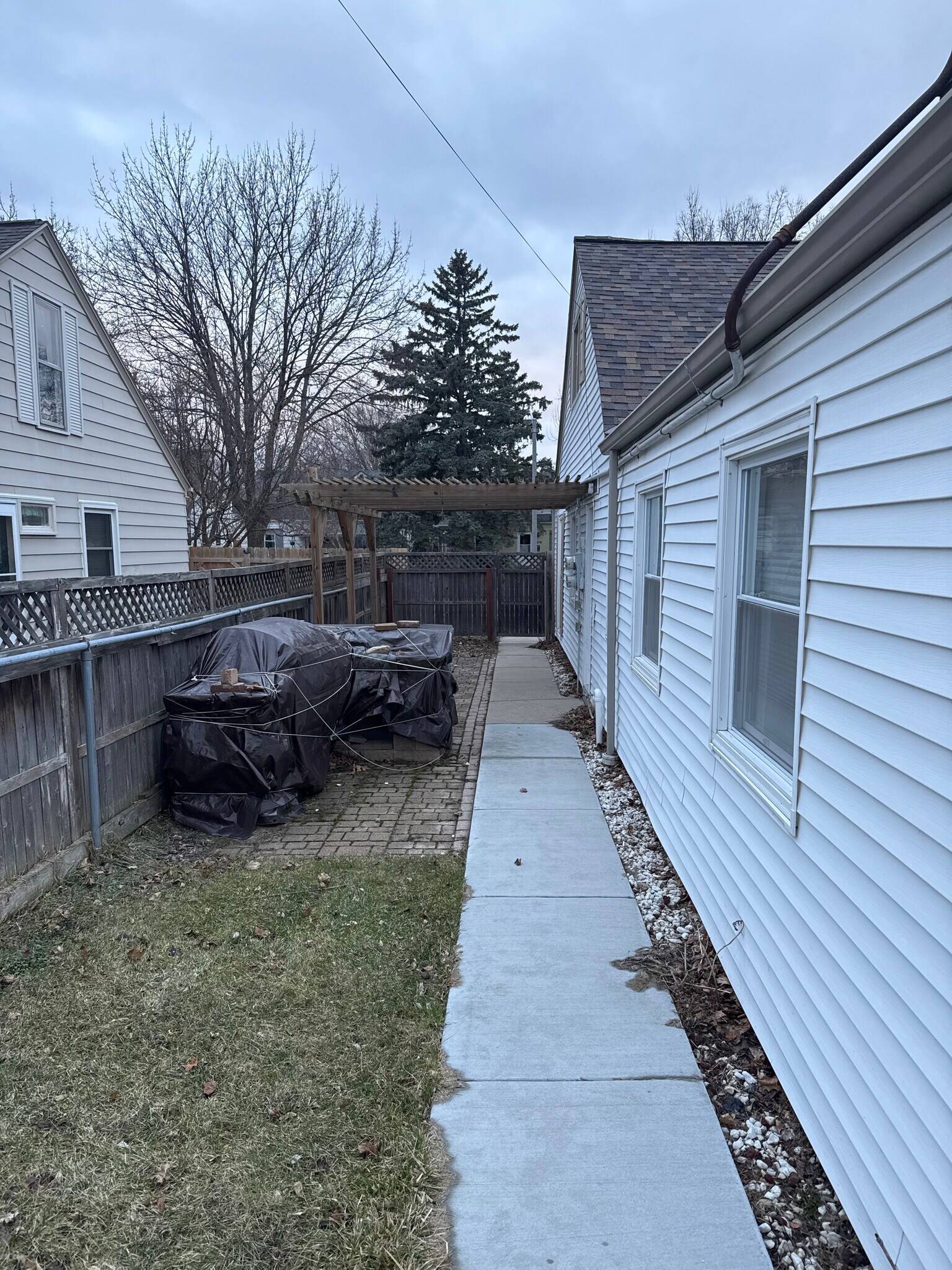 Backyard Area, also has a stone built grill if you’d like me too remove I can. - 3318 S Quincy Ave