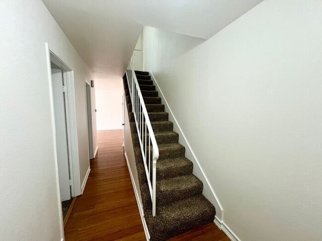 Building Photo - Stunning 4BR Townhome with Hardwood Floors, Private Patio, Community Pool & 2-Car Garage!