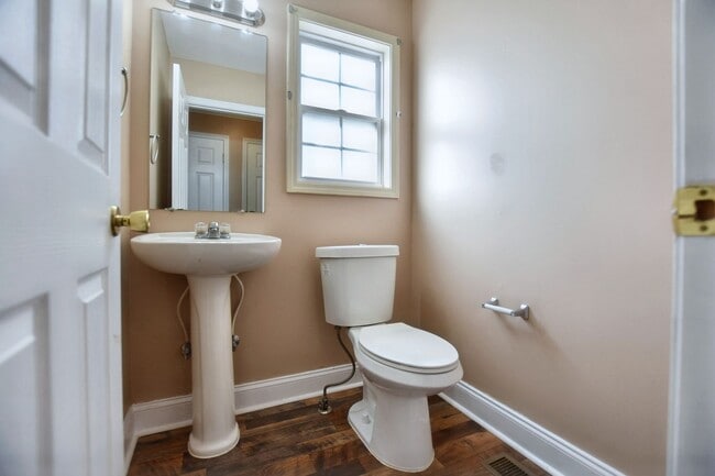 Building Photo - Pet Friendly Three Bedroom with Bonus!