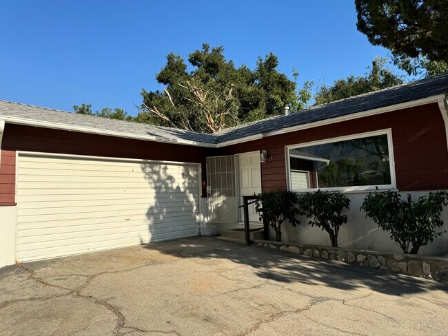 Entrance with 2-car garage - 11052 Plainview Ave