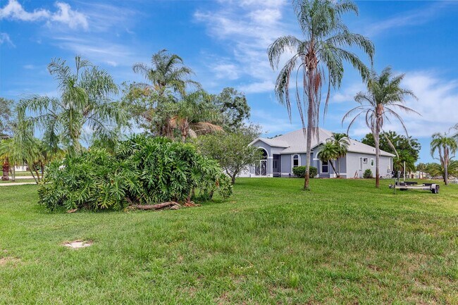 Building Photo - A BOATER'S PARADISE WITH THIS STUNNING 3 BEDROOM, 2 BATH WATERFRONT POOL HOME W/DOCK & BOAT LIFT ...