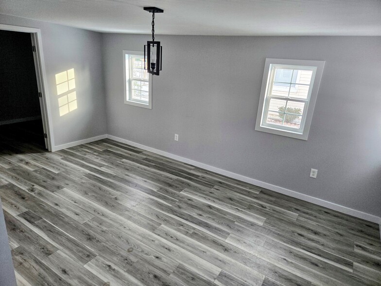 Formal Dining #2 with view toward Laundry - 151 Lilac Dr