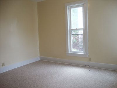 Back bedroom as seen from the living room doorway. - 512 S Center St