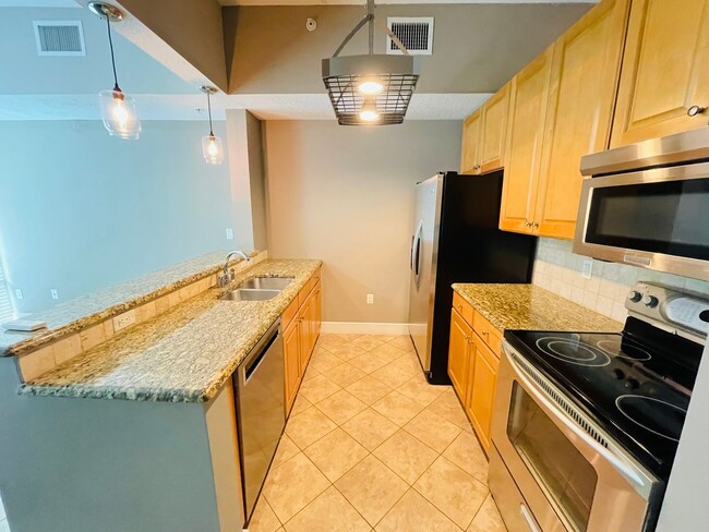 Building Photo - Modern High-Rise Condo in Downtown Orlando...