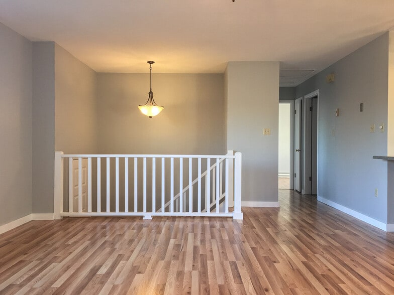 Living room looking towards stairs and hallway to bedrooms - 901 Montana St