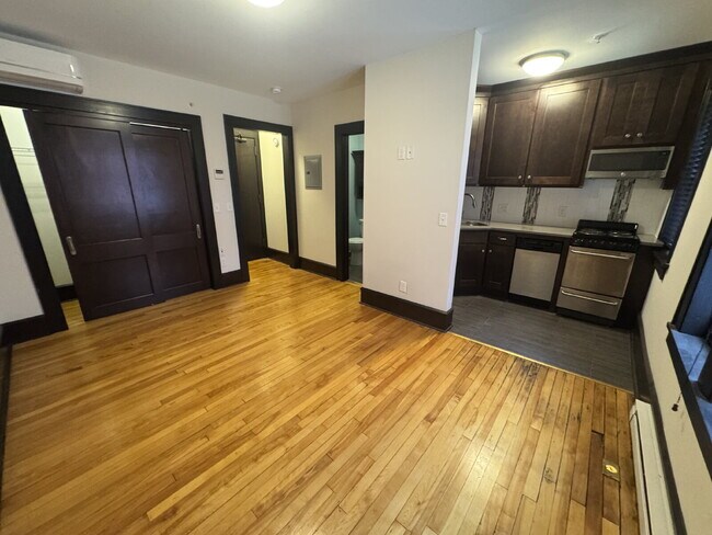 Building Photo - "Charming Studio Retreat with Hardwood Elegance in Downtown Minneapolis!"