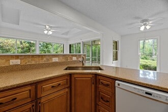 Building Photo - Live Where Others Vacation | Gated Community + Marina Access