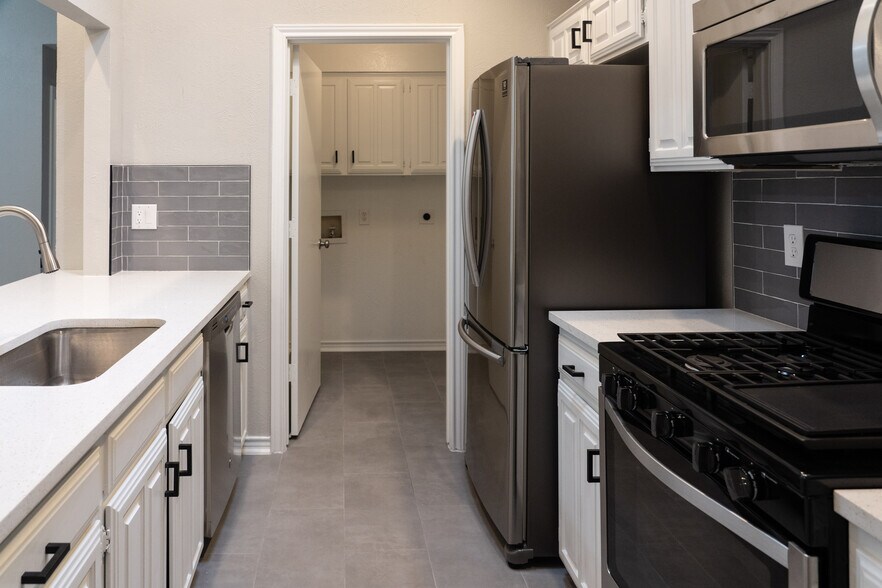 walk in laundry with storage closet thats perfect for linens and cleaning supplies! - 812 Via Madonna