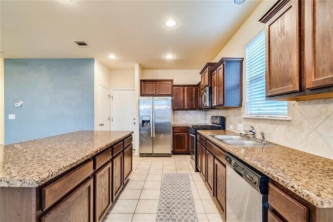 Building Photo - Four Bedroom Home Available for June Move-In!