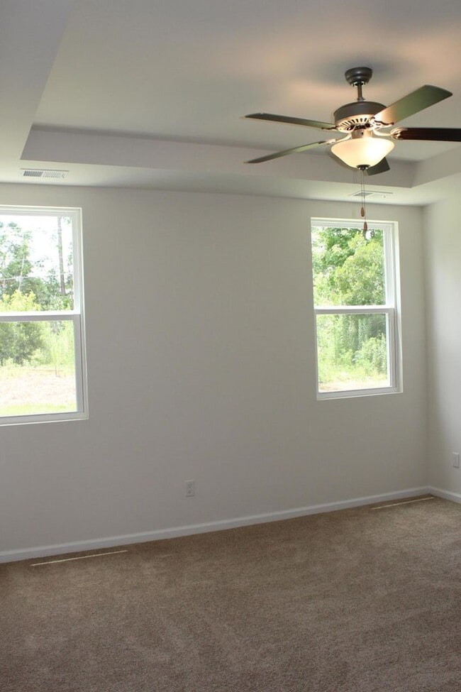 Building Photo - Sun-Filled 3-Story End-Unit Townhome with Fenced Yard, Storage & Resort-Style Pool