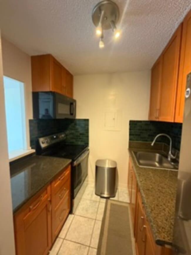 Building Photo - Welcome to your new home at Pearlridge Gardens & Tower! This 1-bedroom, 1-bathroom condo $2,100