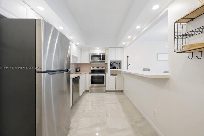 Building Photo - 19370 Collins Ave