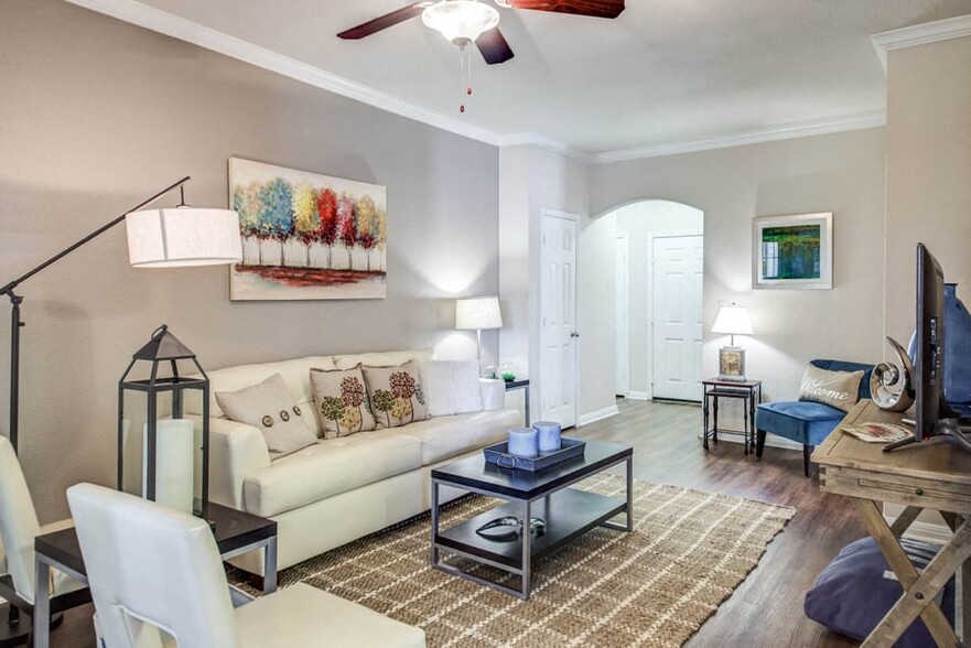 Apartments for Rent in Austin TX - Open Space Living Room with Hardwood Floors, Stylish Interior, and Ceiling Fan - Abelia Flats