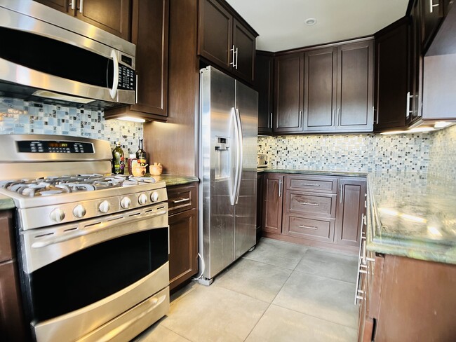 Kitchen cabinets space is plentiful. - 6301 Coldwater Canyon Ave