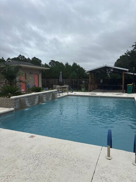 Relax in inviting pool - 21 Oak Alley Ln