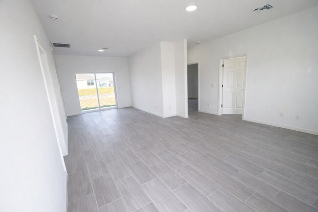 Building Photo - BRAND NEW MODERN SF HOME 3BD+den/2BA with GARAGE IN LEHIGH ACRES!