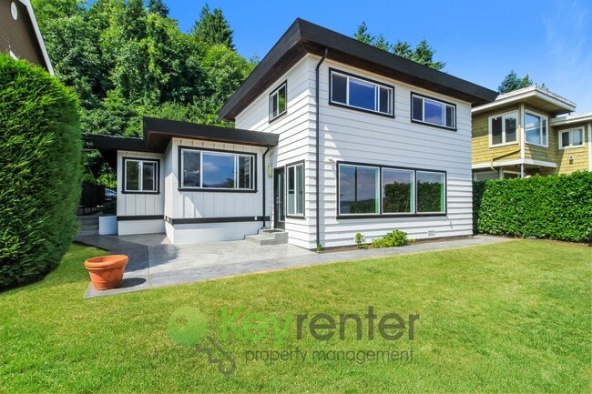 Building Photo - Waterfront Elegance with Private Dock and Designer Finishes