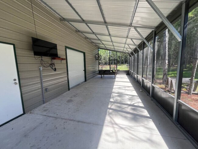 Building Photo - Gorgeous 3-Bedroom Log Cabin with Loft, Large Shop & Stocked Pond – Near Branford, FL