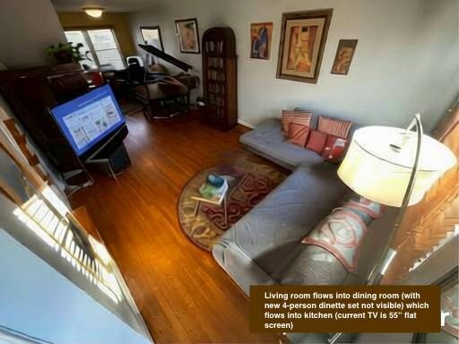 Open 1st floor plan includes baby grand piano and dining set (far wall) - 1723 N Cliff St