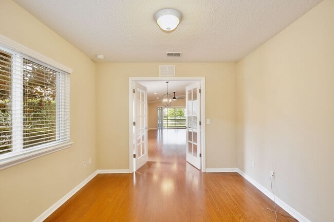 Building Photo - AGENT SHOWINGS ONLY! Gorgeous 2/2 + Den Mediterranean Villa with Waterfront Screened Patio and 2-...