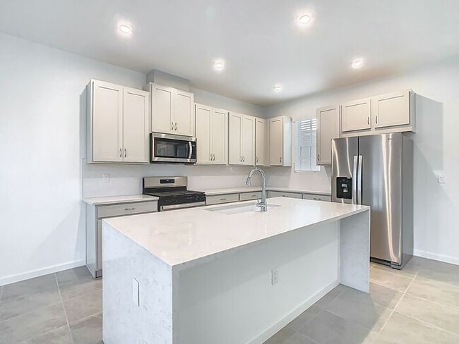 Building Photo - New Luxury Townhome in Celebration with All porcelain tiled floors. Island Village new construction