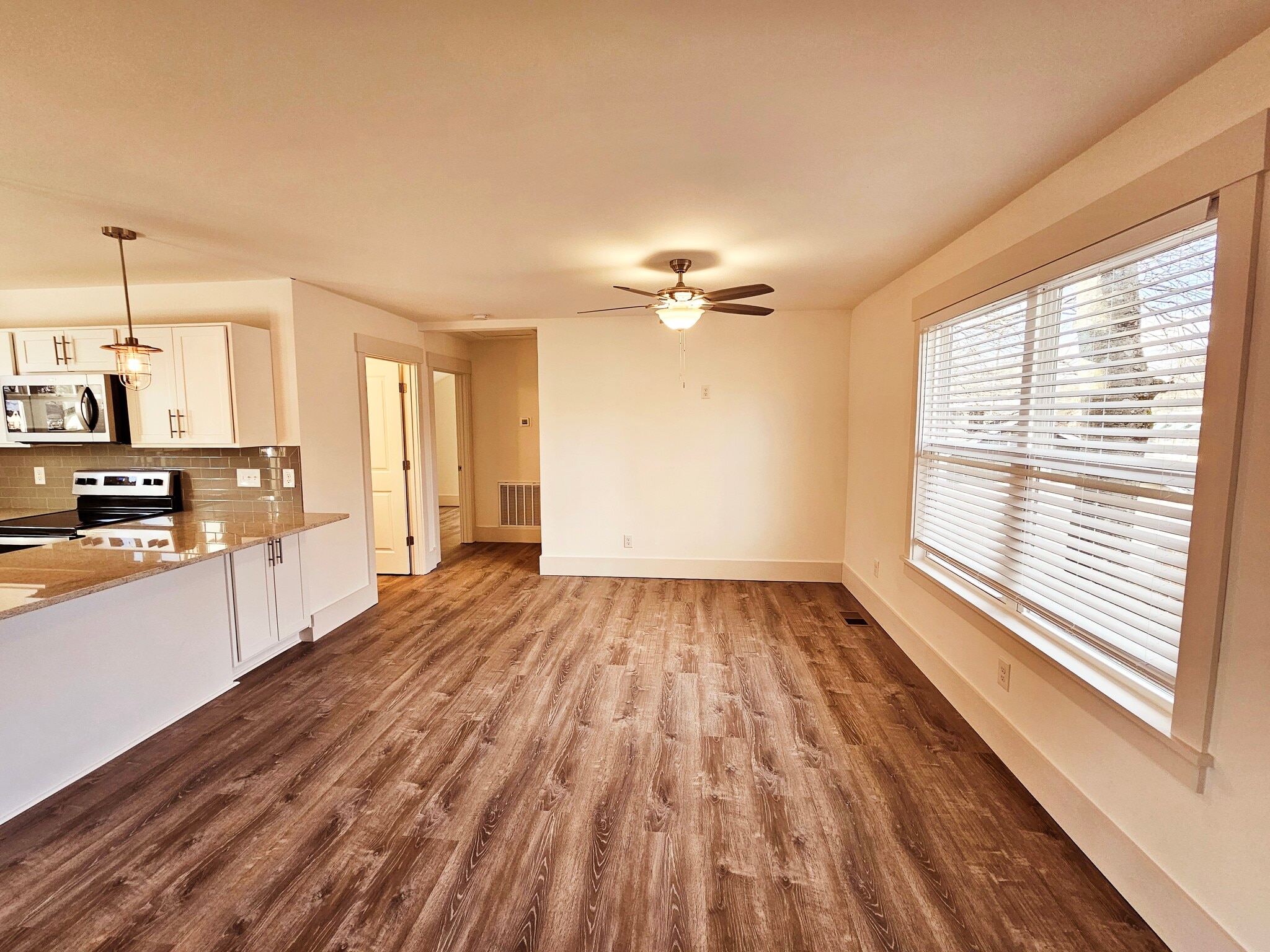 Huge living room windows let in lots of light. - 1219 N 7th St