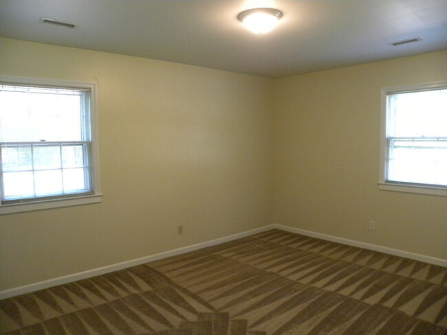 Building Photo - 4BR brick home with rocking chair porch, f...