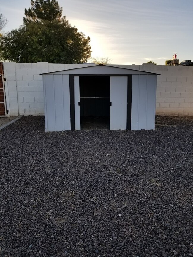 Storage shed in fenced yard - 205 E. Oxford Dr.