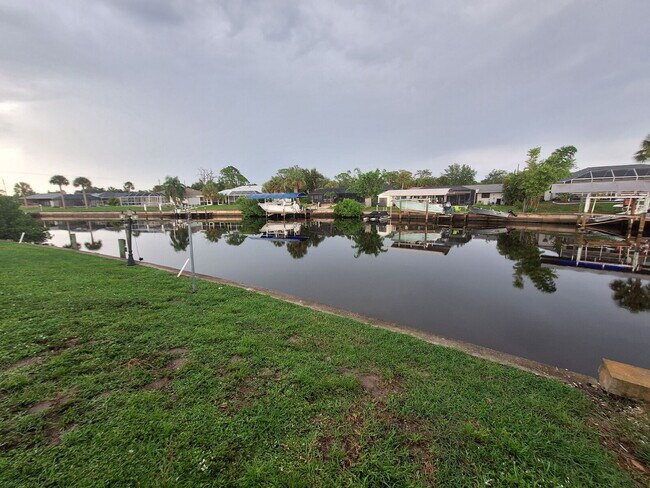 Building Photo - Gulf Access Home on Canal Available Now