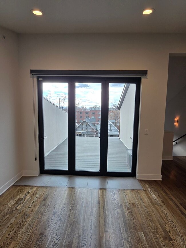 Building Photo - STUNNING 4-LEVEL TOWNHOME IN HIGHLANDS WITH SAUNA, 2-CAR GARAGE + AMAZING ROOFTOP DECK!